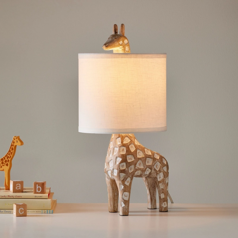 Natural linen shade and carved giraffe lamp body