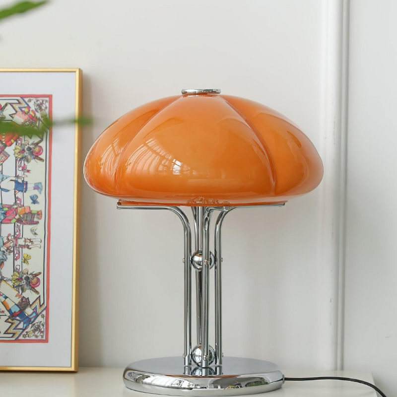 Caramel Hector table lamp on a console with artwork