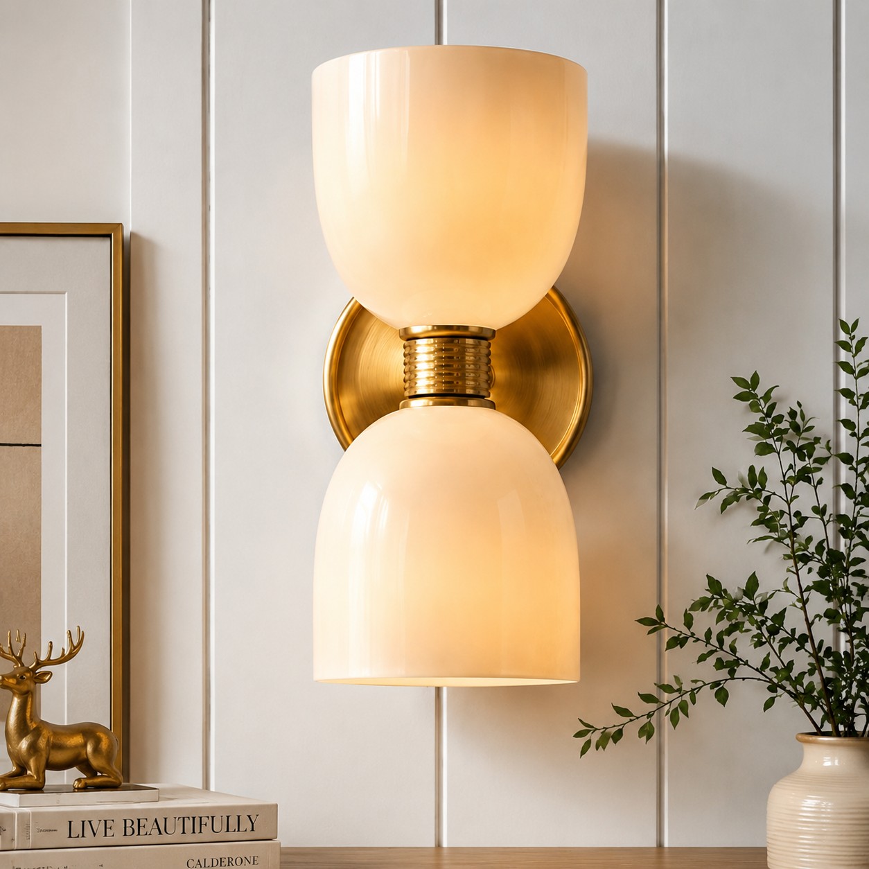 Close view of Ellen brass wall sconce with milk glass shades