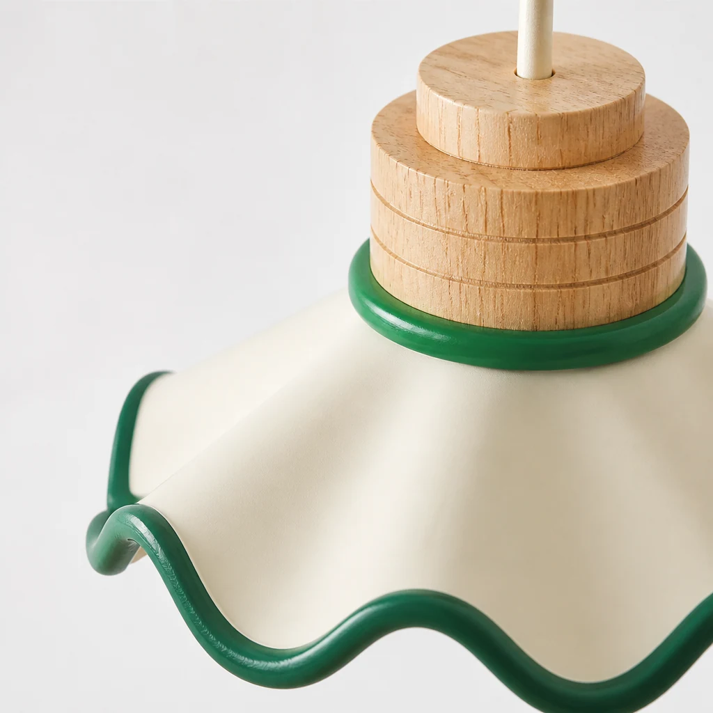 Close-up detail of Tilda scalloped resin shade and wood-accented fitting