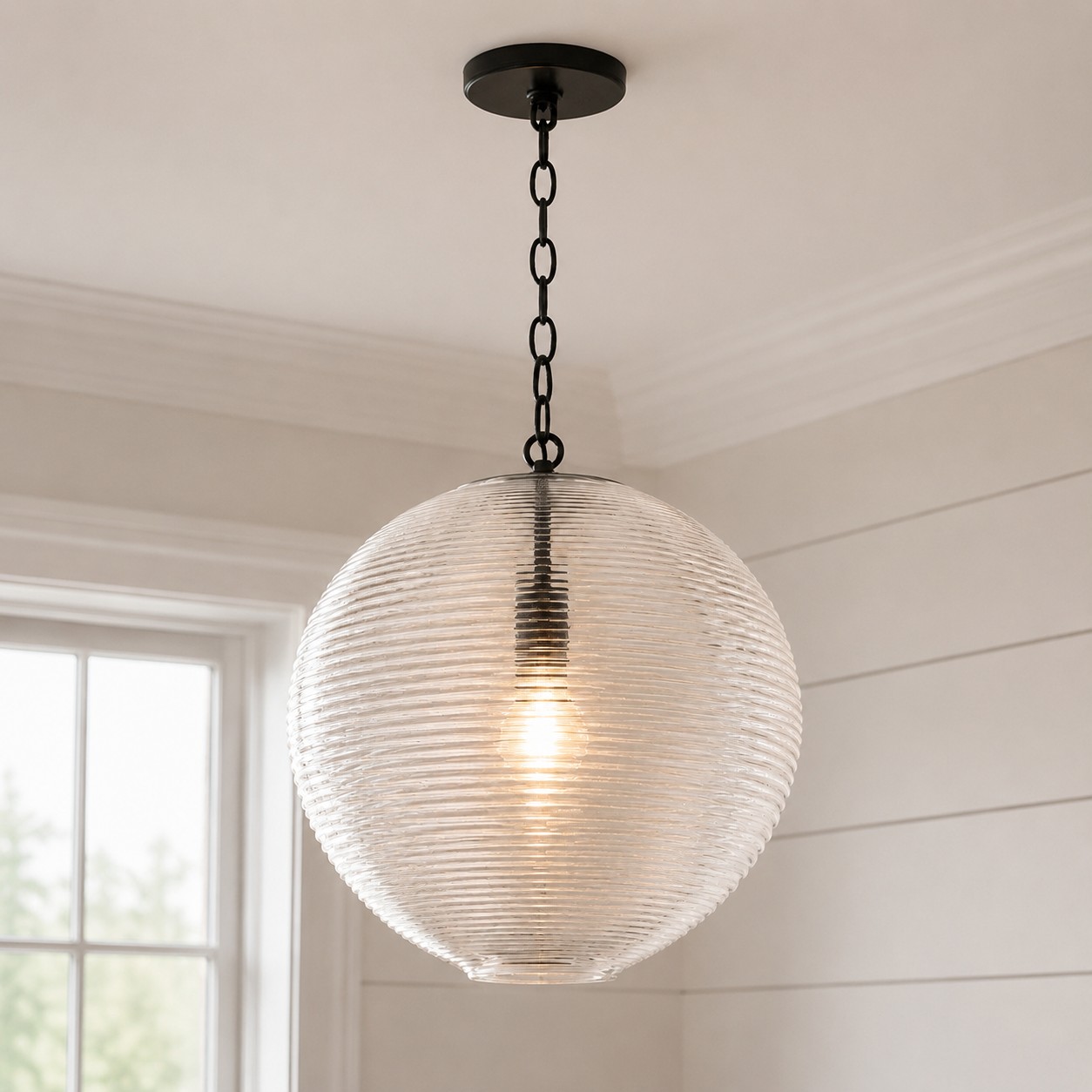 Matte Black Ricky pendant installed near a window