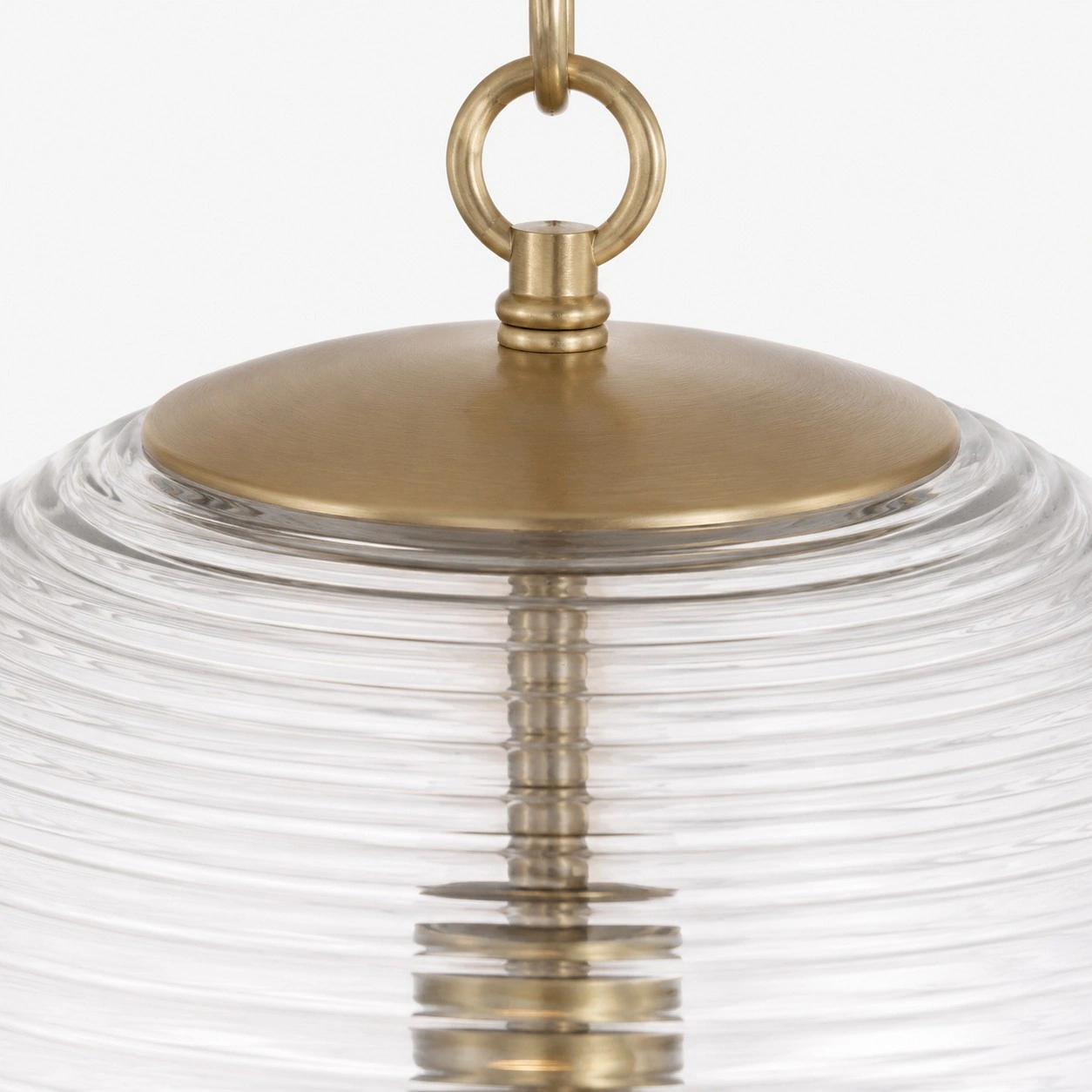 Close-up of Matte Brass canopy hardware and clear ribbed globe glass