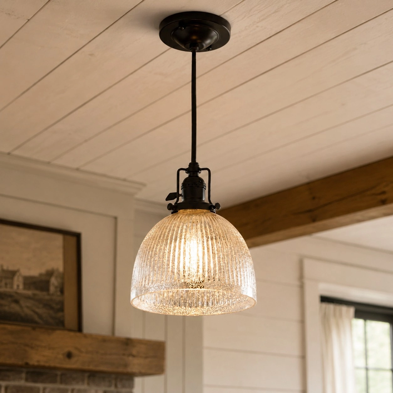 Single ribbed glass pendant glowing in a room setting
