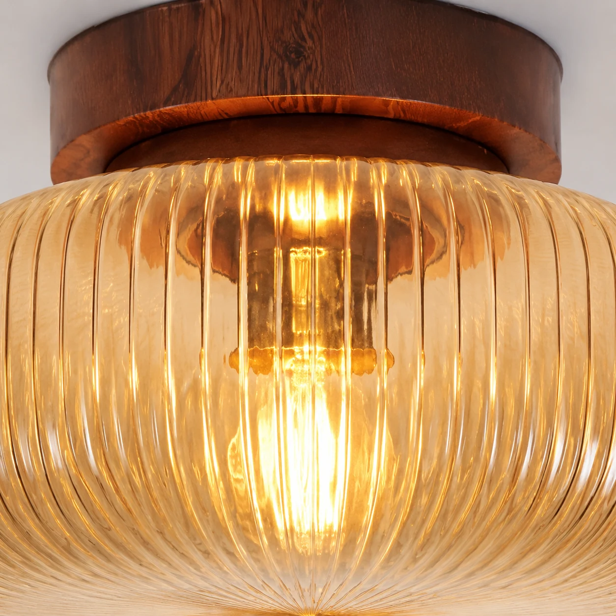 Close-up of ribbed glass and metal detail on the Kelly ceiling light