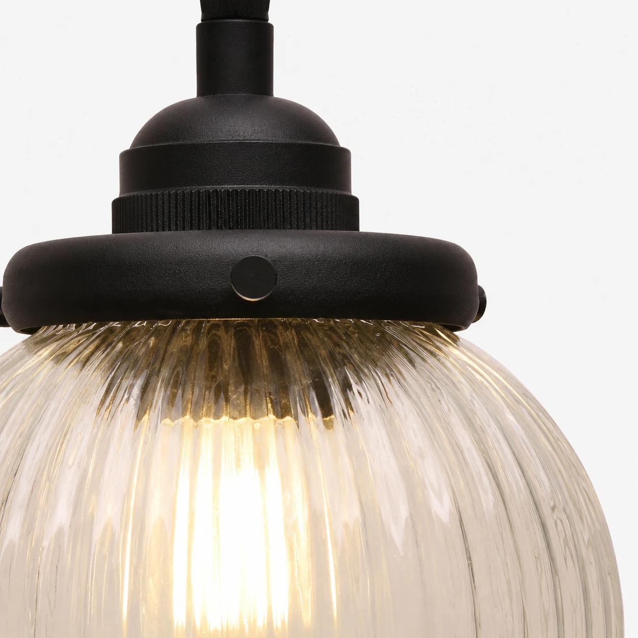 Close-up detail of ribbed glass and metal finish on the Jamil pendant light