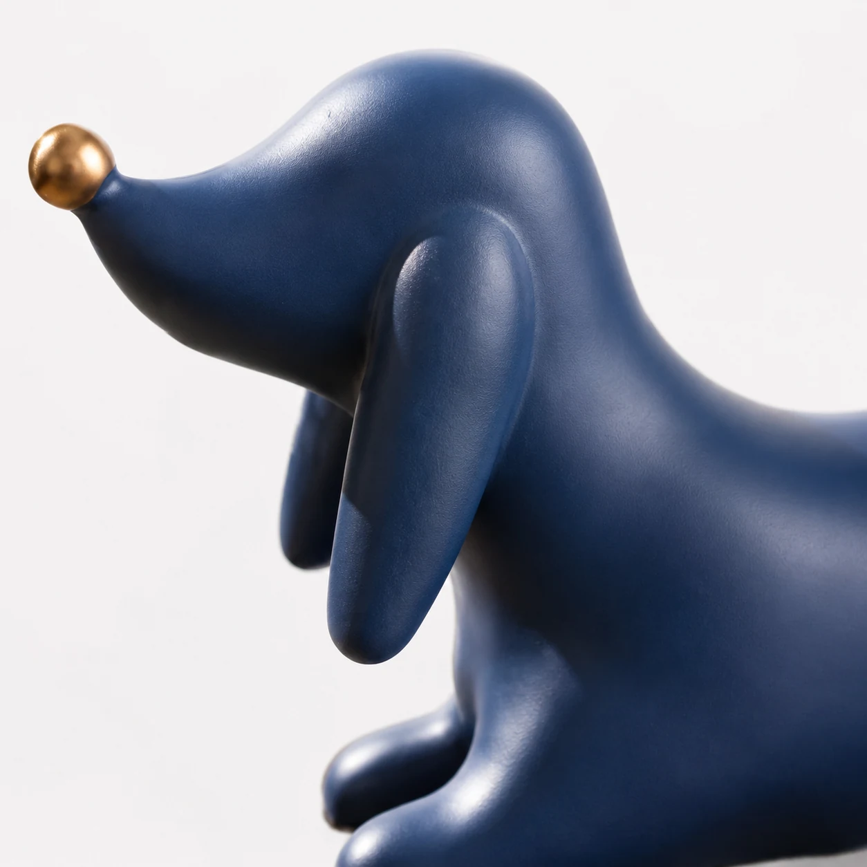Close view of the blue resin surface and sculpted dachshund detail