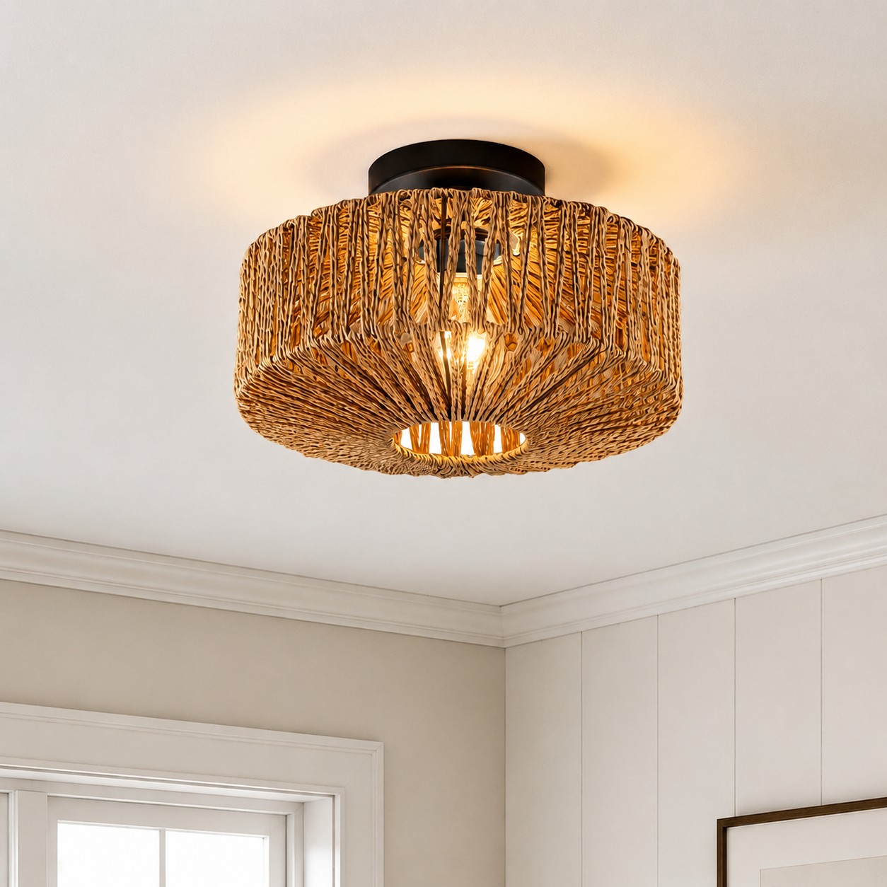 Balriel rattan flush mount ceiling light lit in a room setting