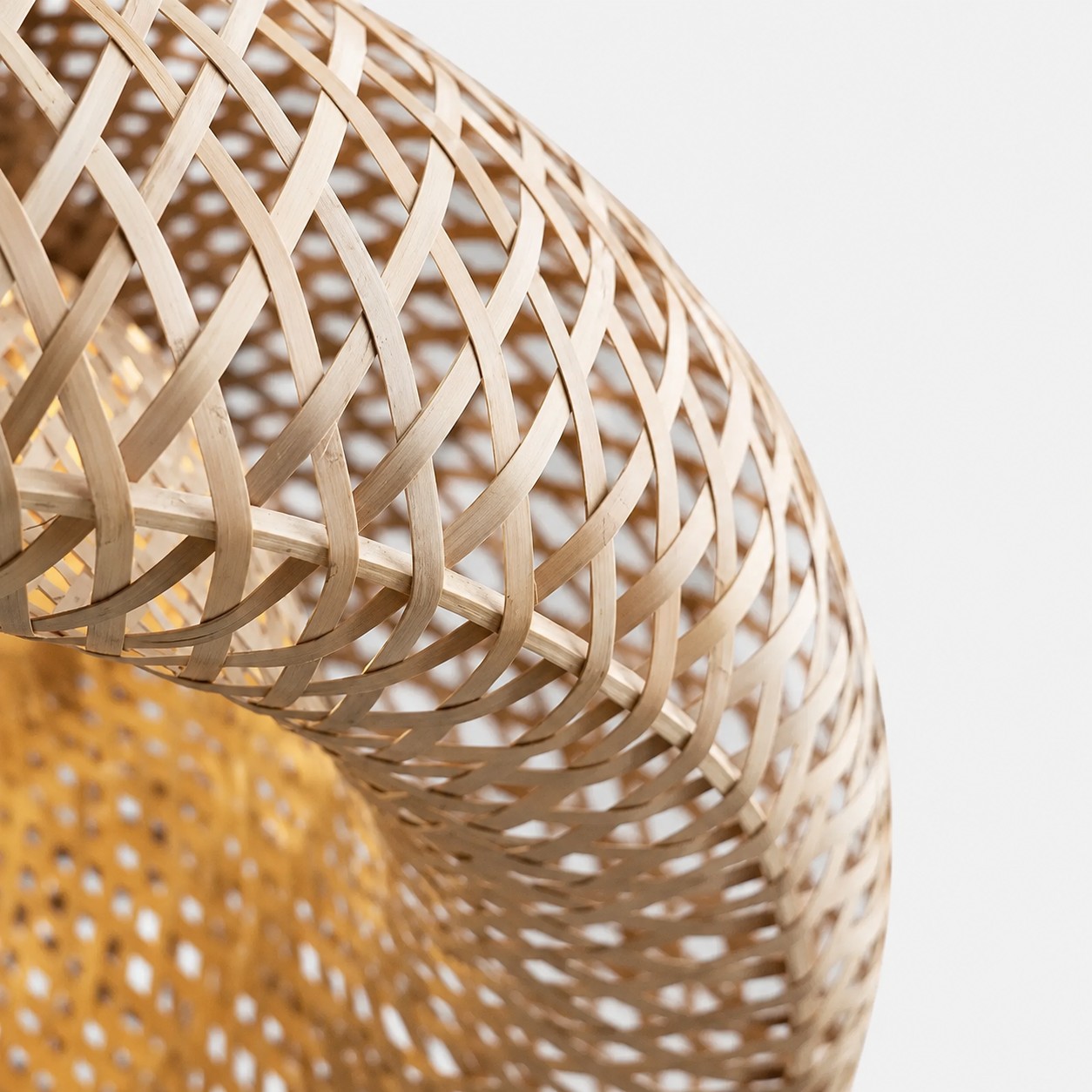 Close-up of woven rattan construction and warm illuminated diffuser