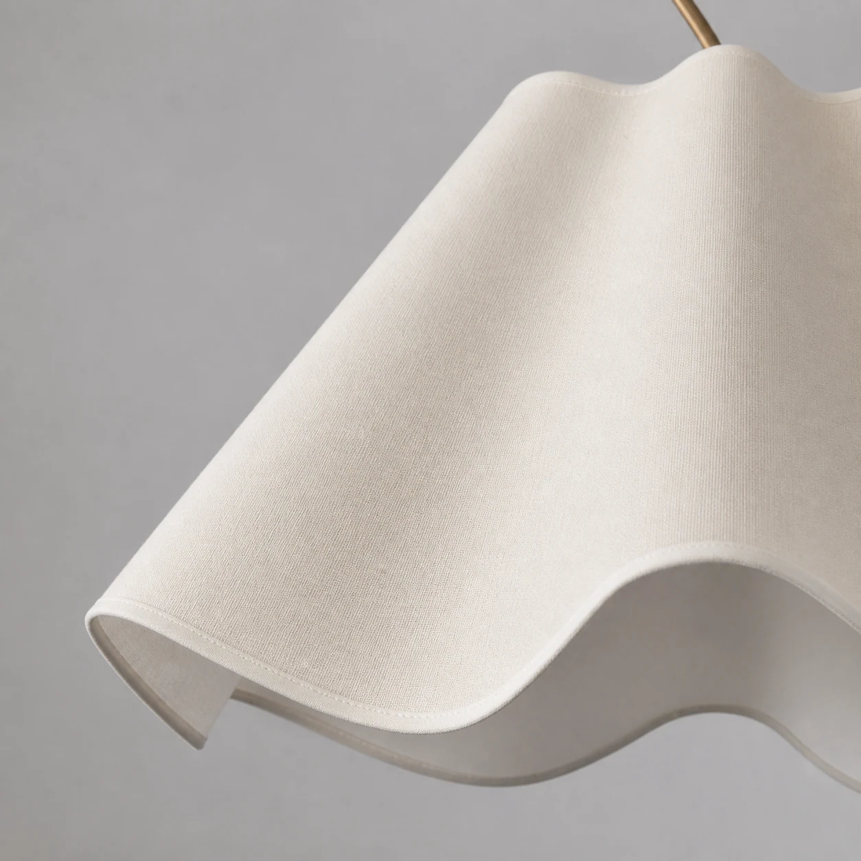 Close-up detail of the Ellara ivory scalloped linen shade texture