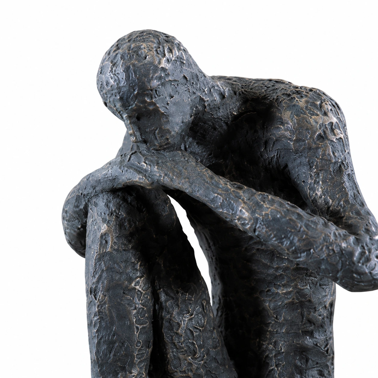Close view of the figure's contemplative pose