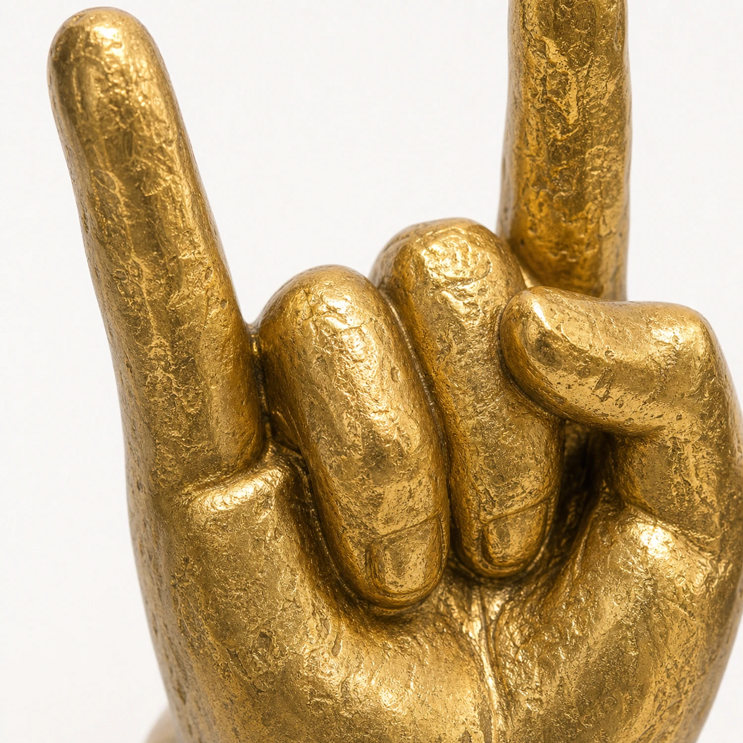 Macro view of sculpted fingers and recessed patina
