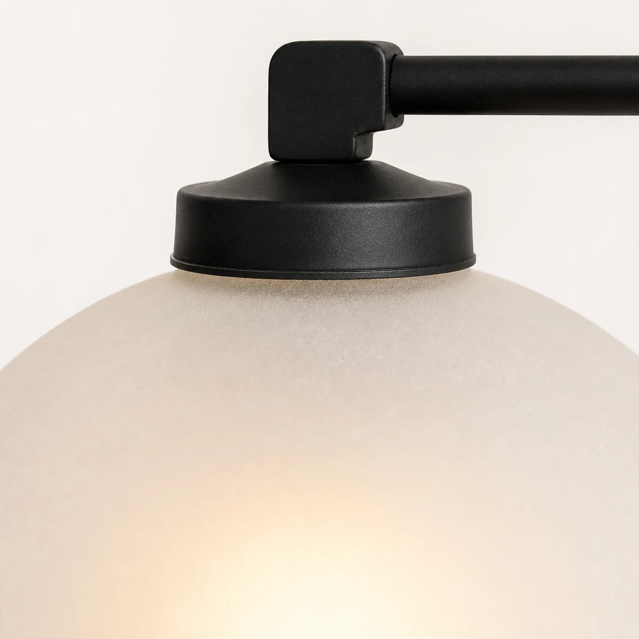 Frosted glass and black shade holder detail