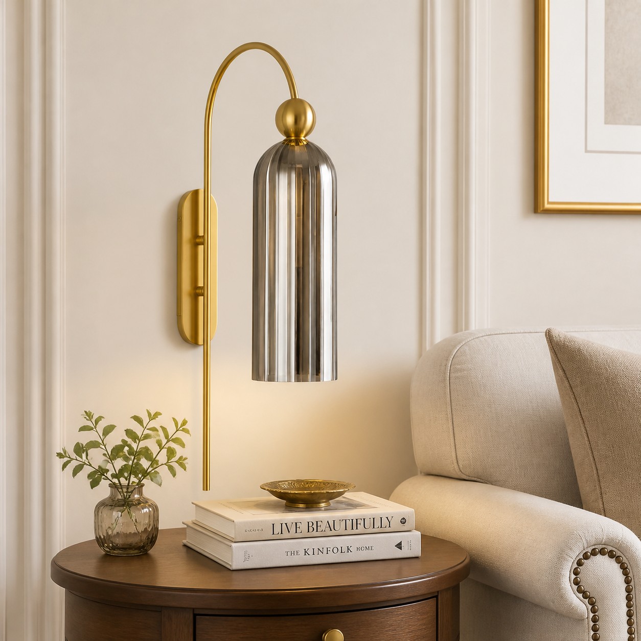 Gray glass Azura wall sconce beside a reading chair