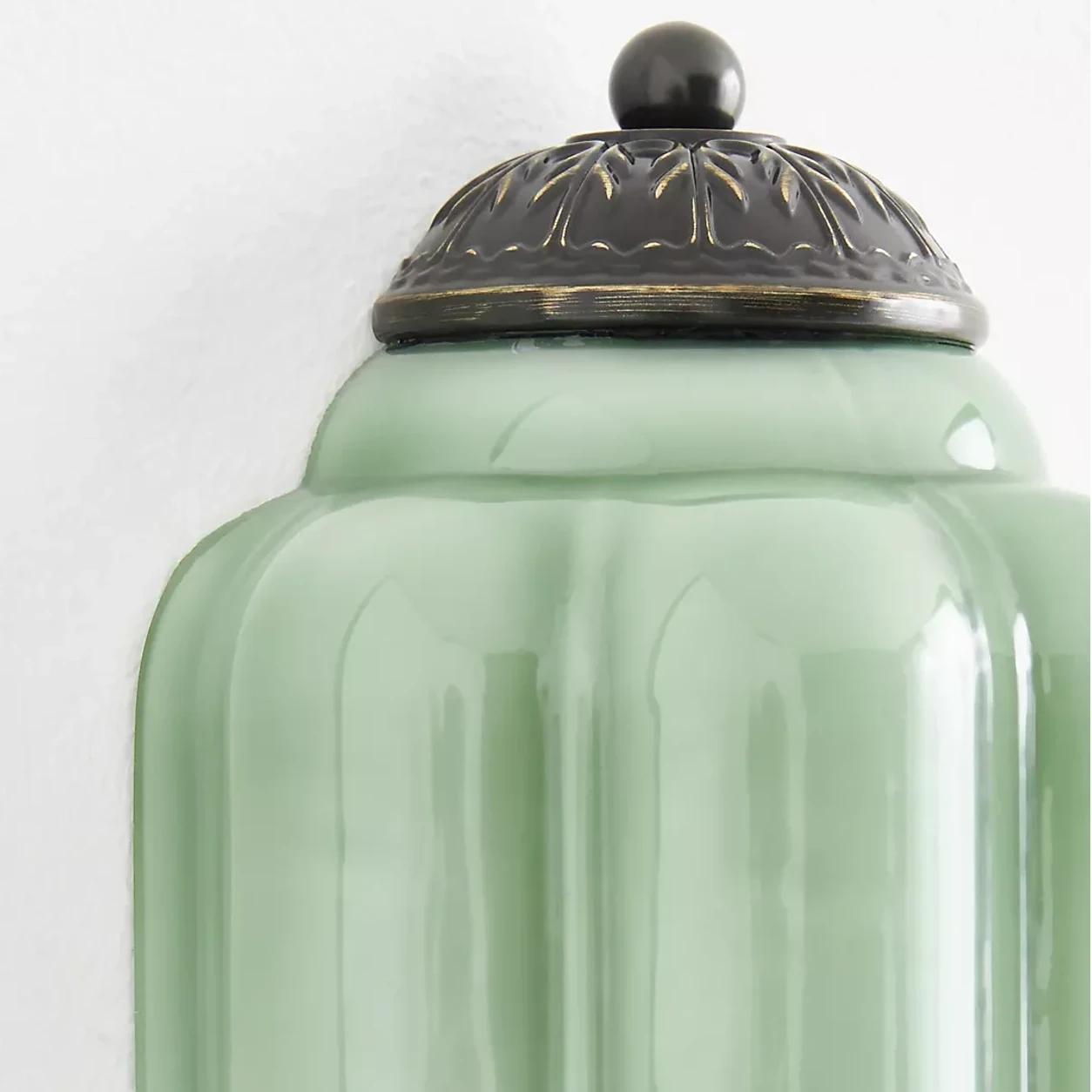 Calynis black upper cap and green fluted glass detail