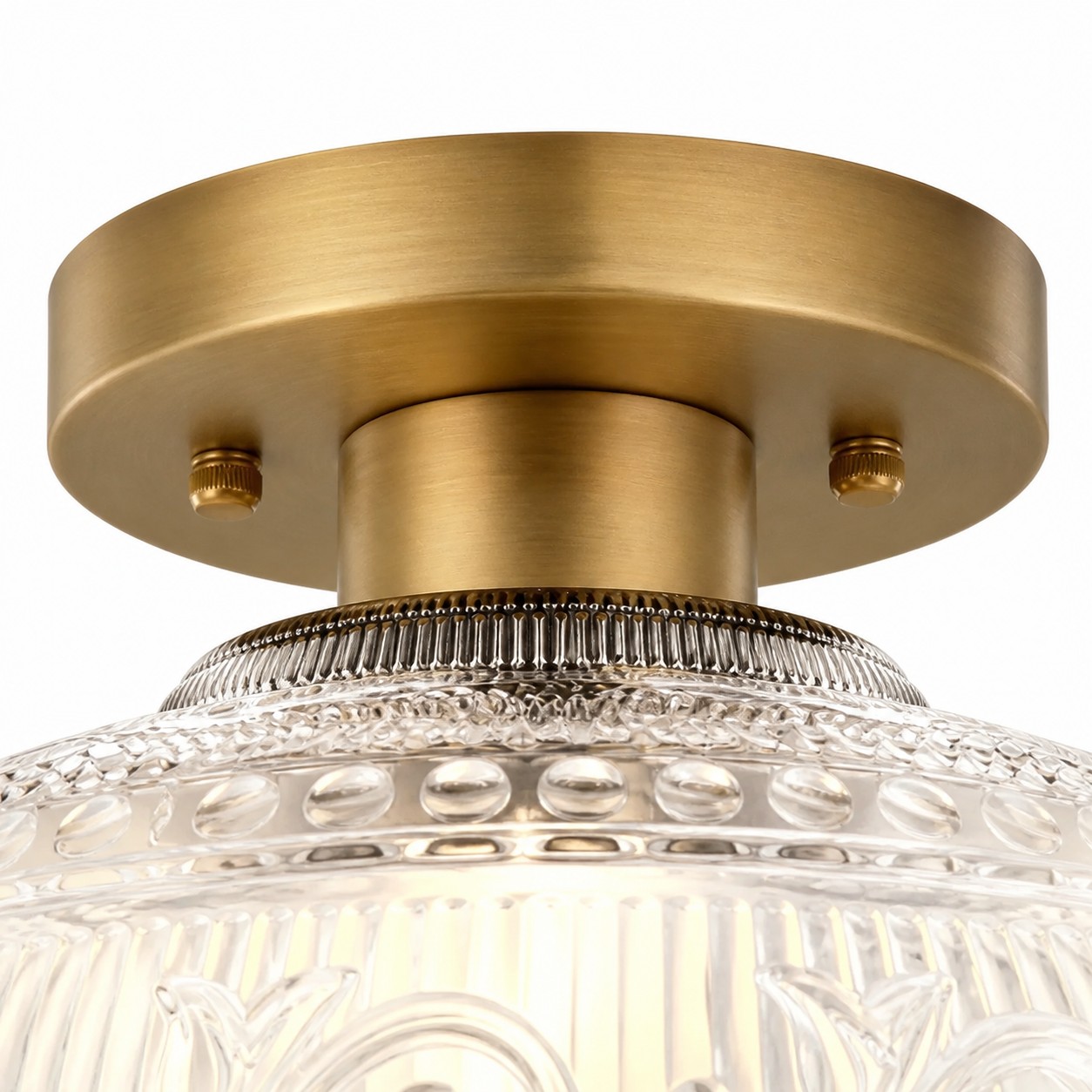Close view of clear engraved glass and brass hardware