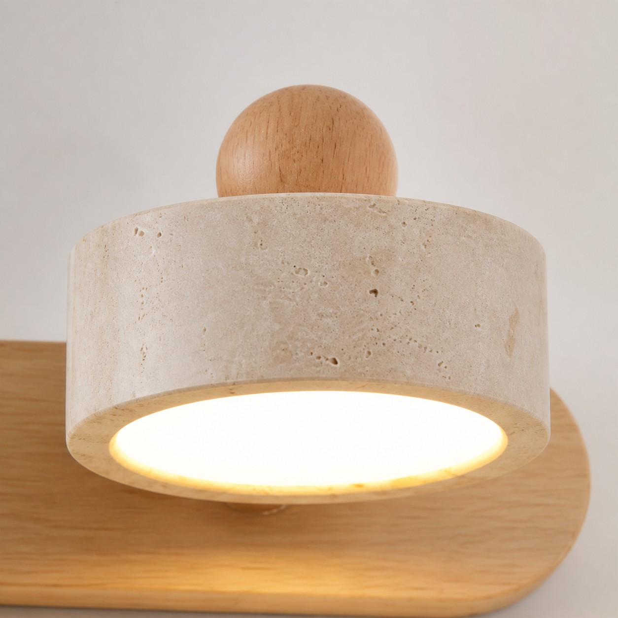 Close view of Merritt travertine shade and wood mount