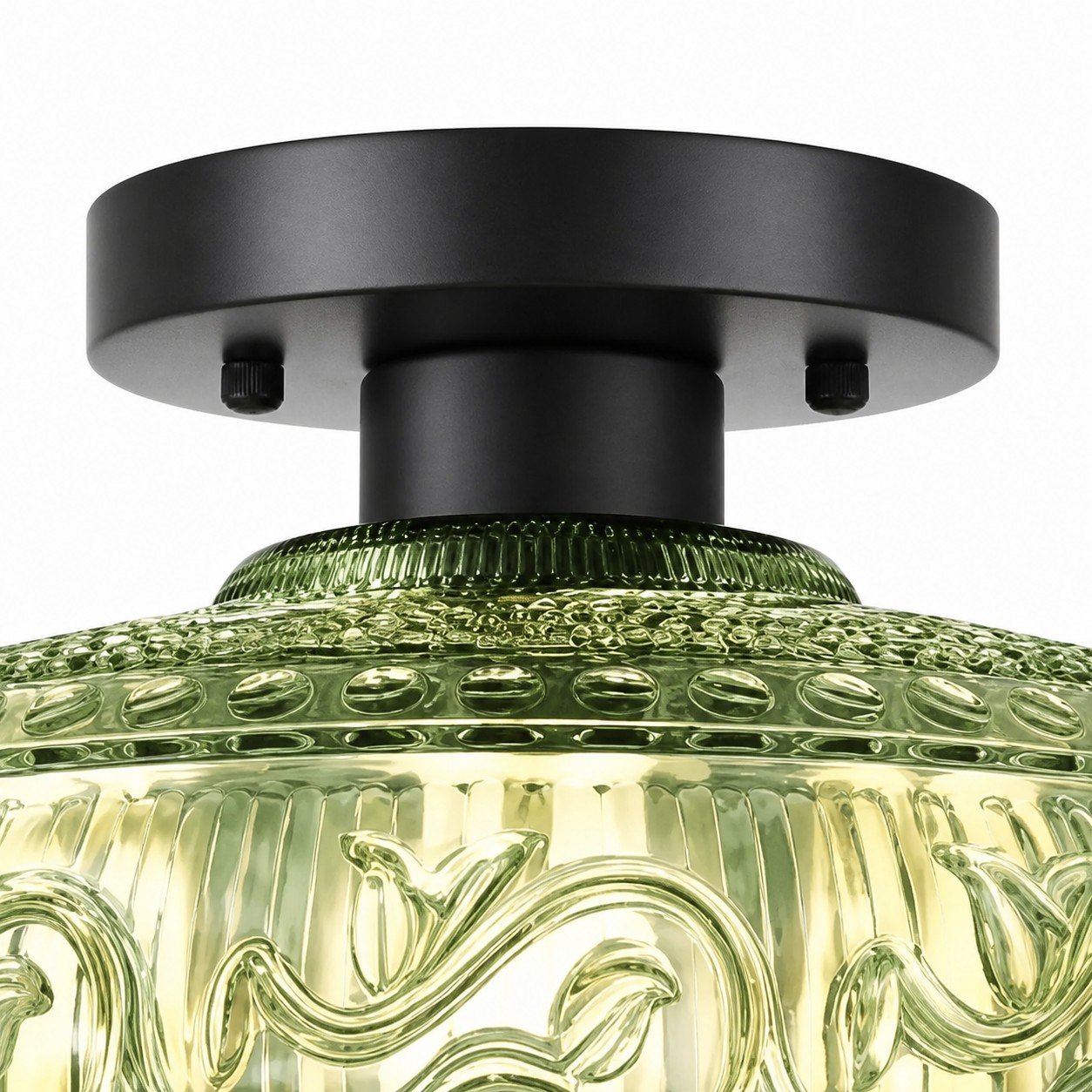 Close view of green engraved glass and black hardware