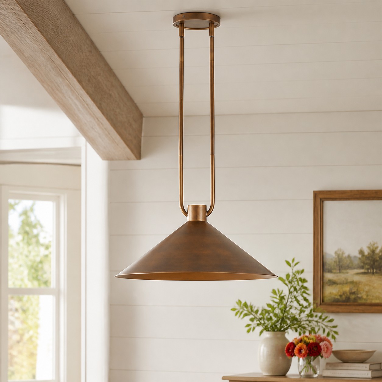 Brass Zane pendant shown fully in a bright living space