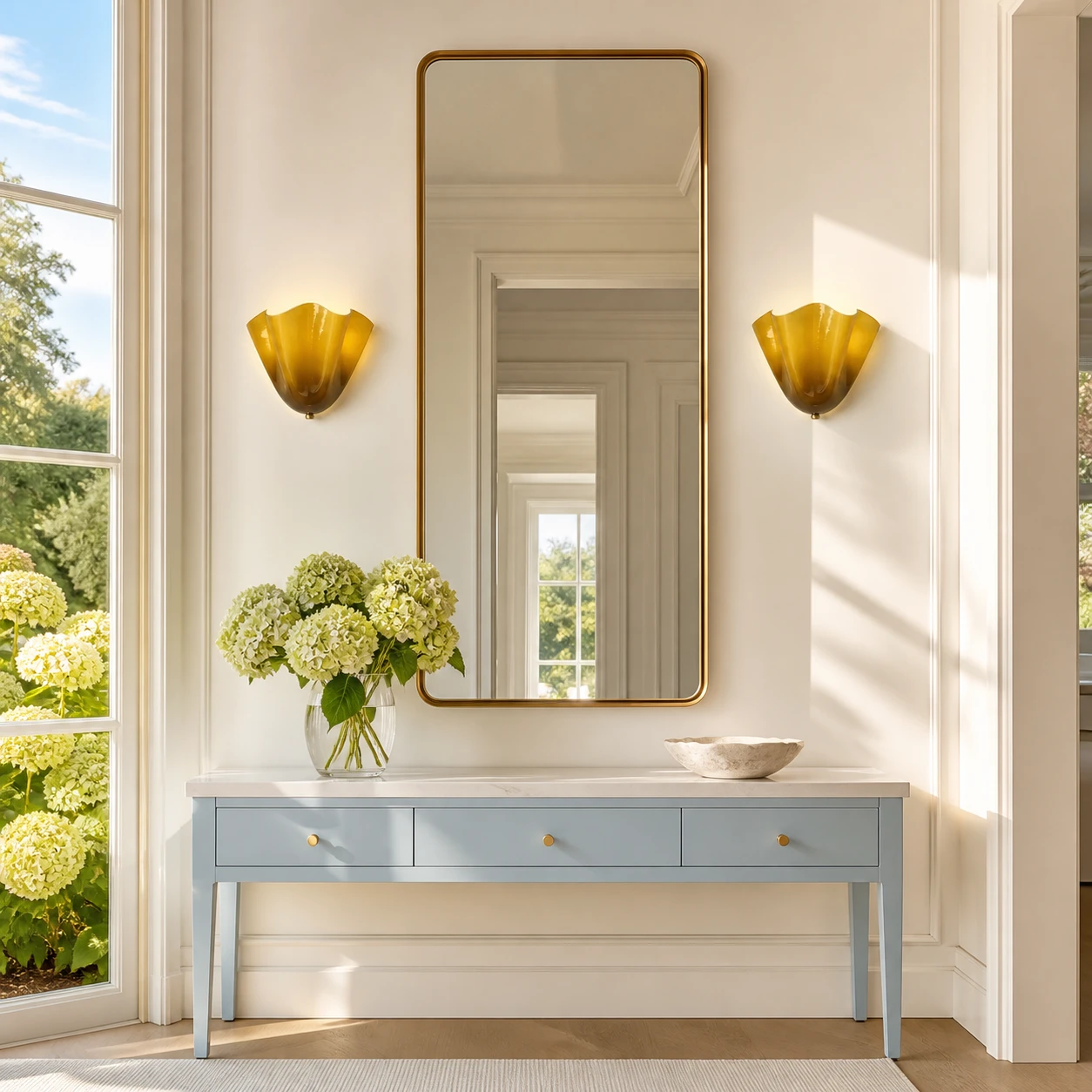 Amber Hett sconces in a sunlit garden entry