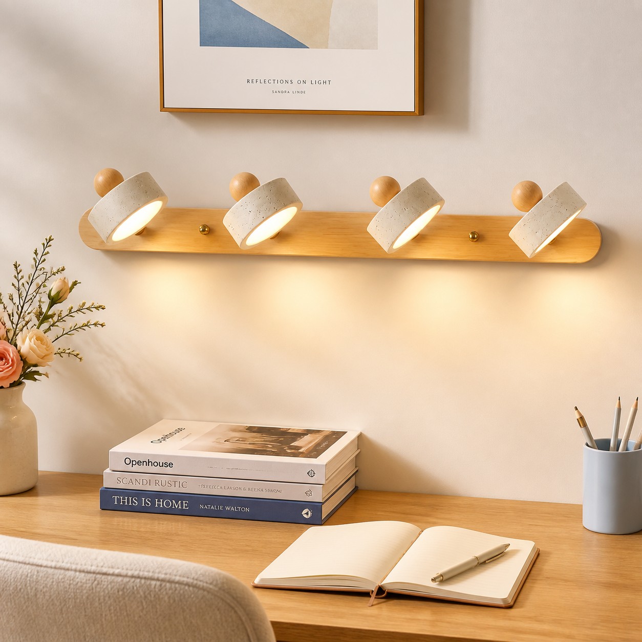 Four-head Merritt travertine and wood wall sconce above a desk
