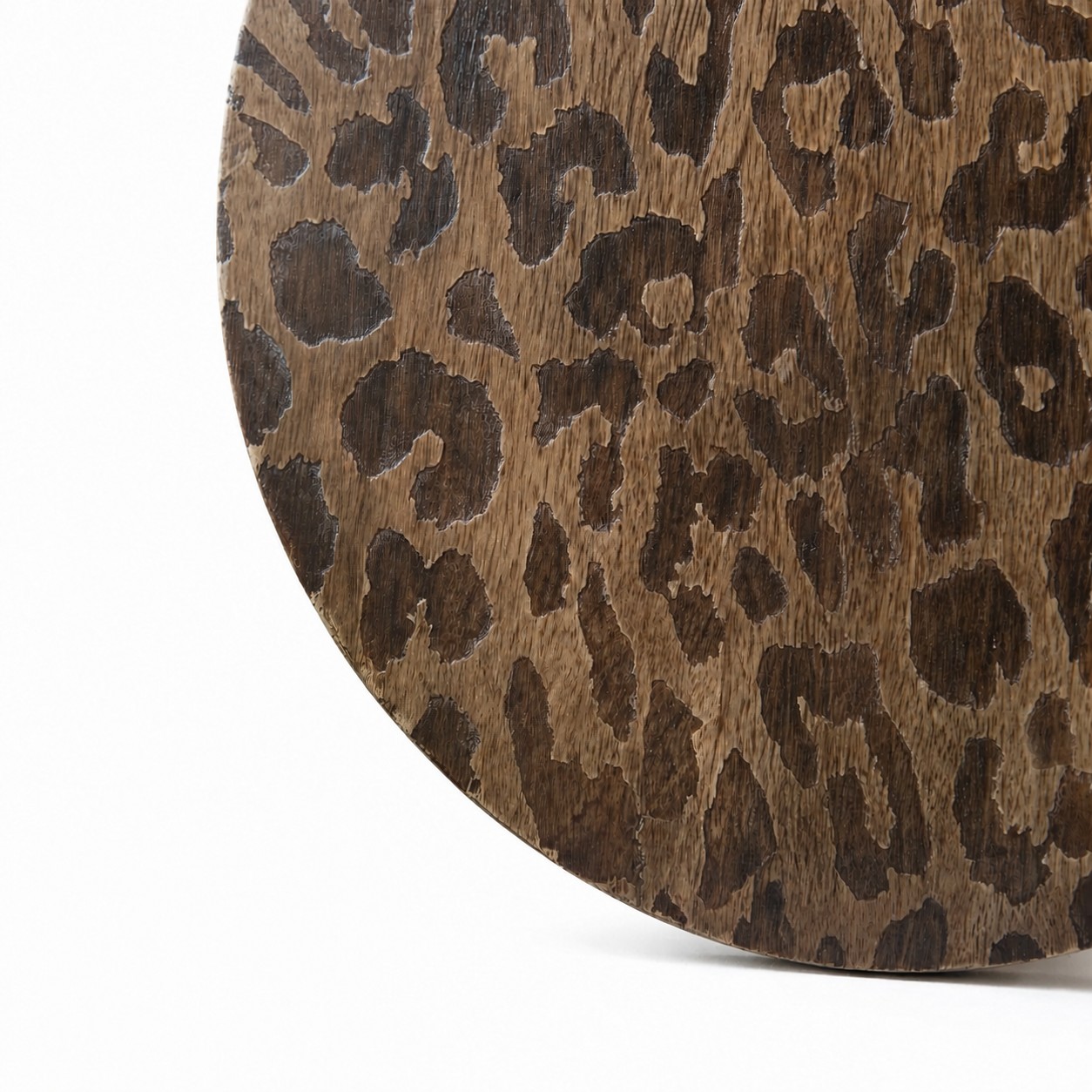 Close view of etched leopard pattern and mango wood grain