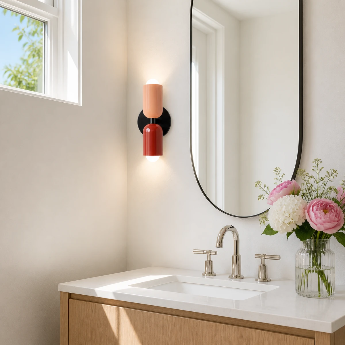 Barra wall light beside a bright powder room mirror