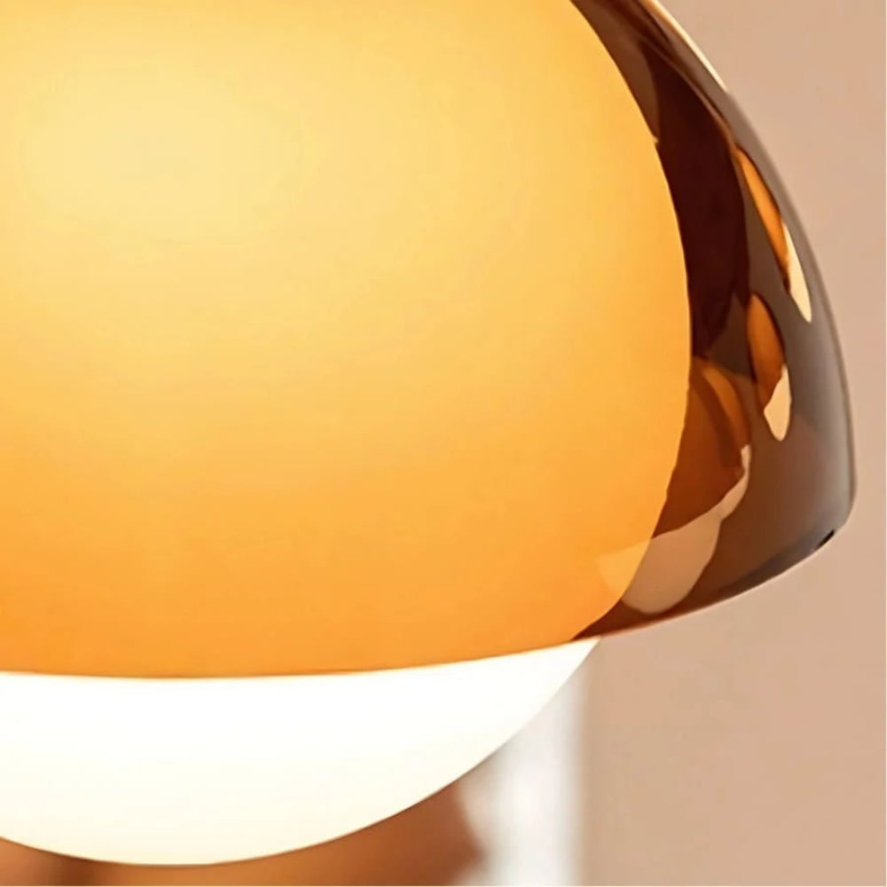 Close detail of translucent amber acrylic and milk-white diffuser