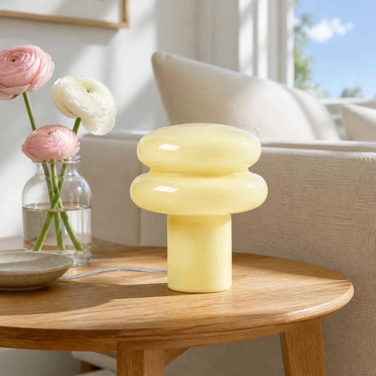 Light yellow Lailly lamp in a close living room side table scene