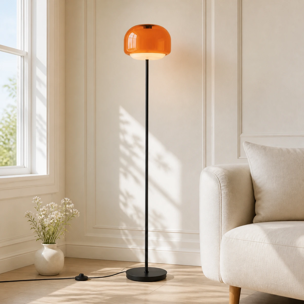 Close Orange Sanae floor lamp against a sunlit paneled wall