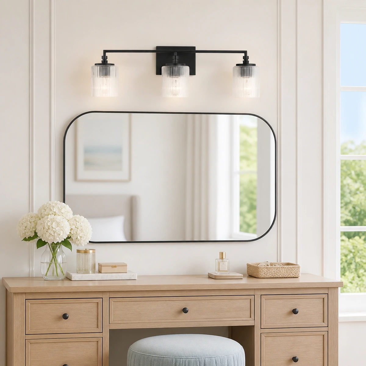 Midnight Black Serel wall sconce above a bright bedroom dresser