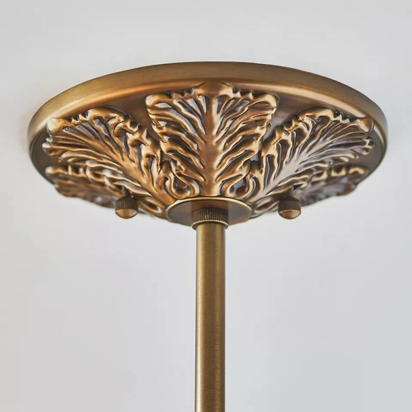 Ornate aged brass ceiling canopy detail