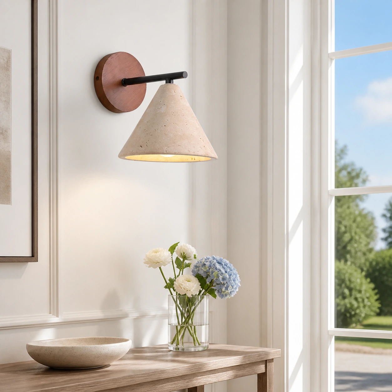 Travertine cone wall light in a sunlit modern American entry