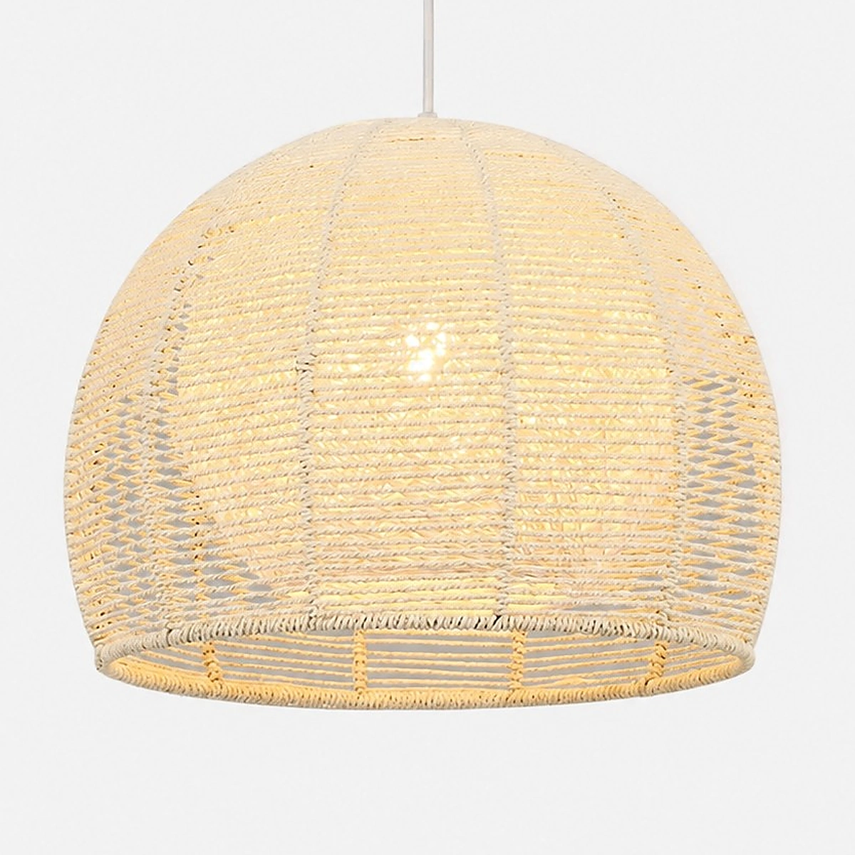 Close view of the beige woven rattan shade