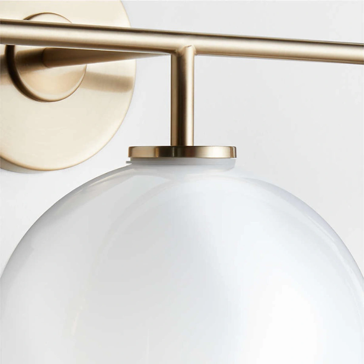 Close view of the brass stem and frosted glass globe