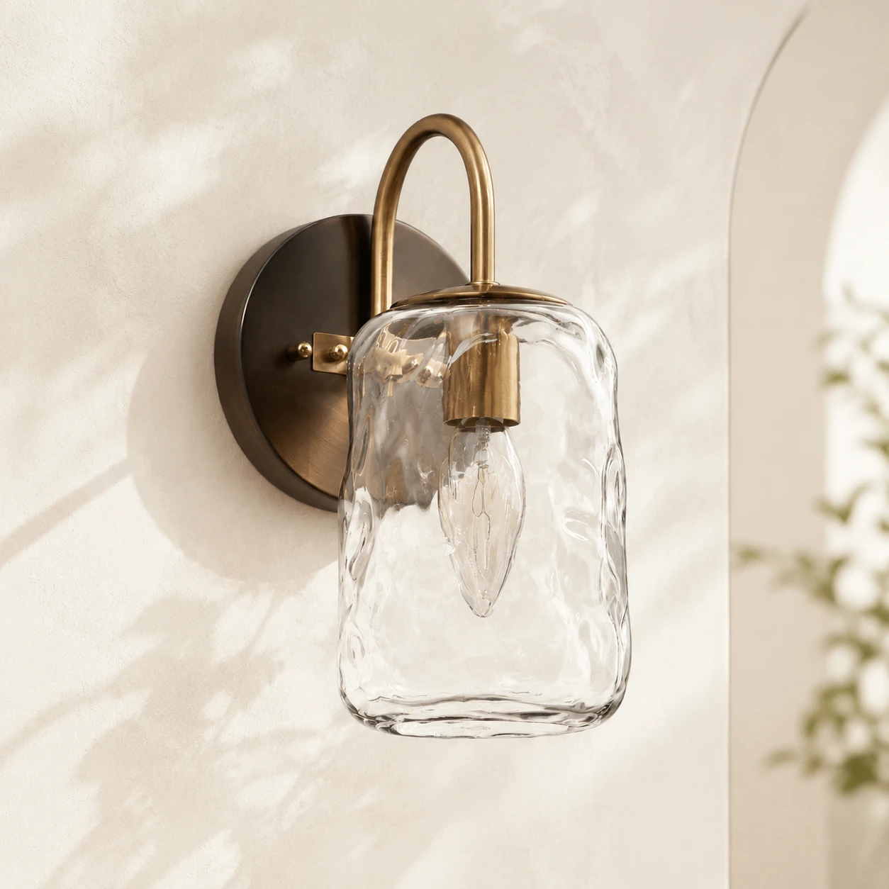 Blythe hammered glass wall sconce in bright daylight with the light off