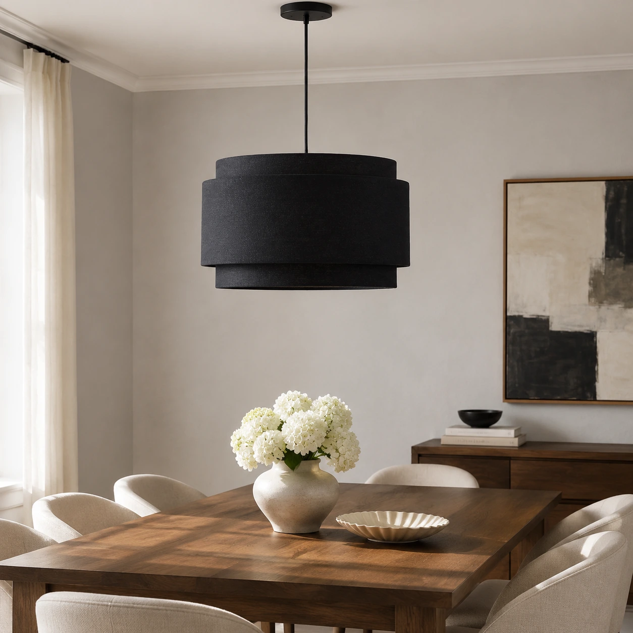 Black Hayden pendant above a walnut dining table