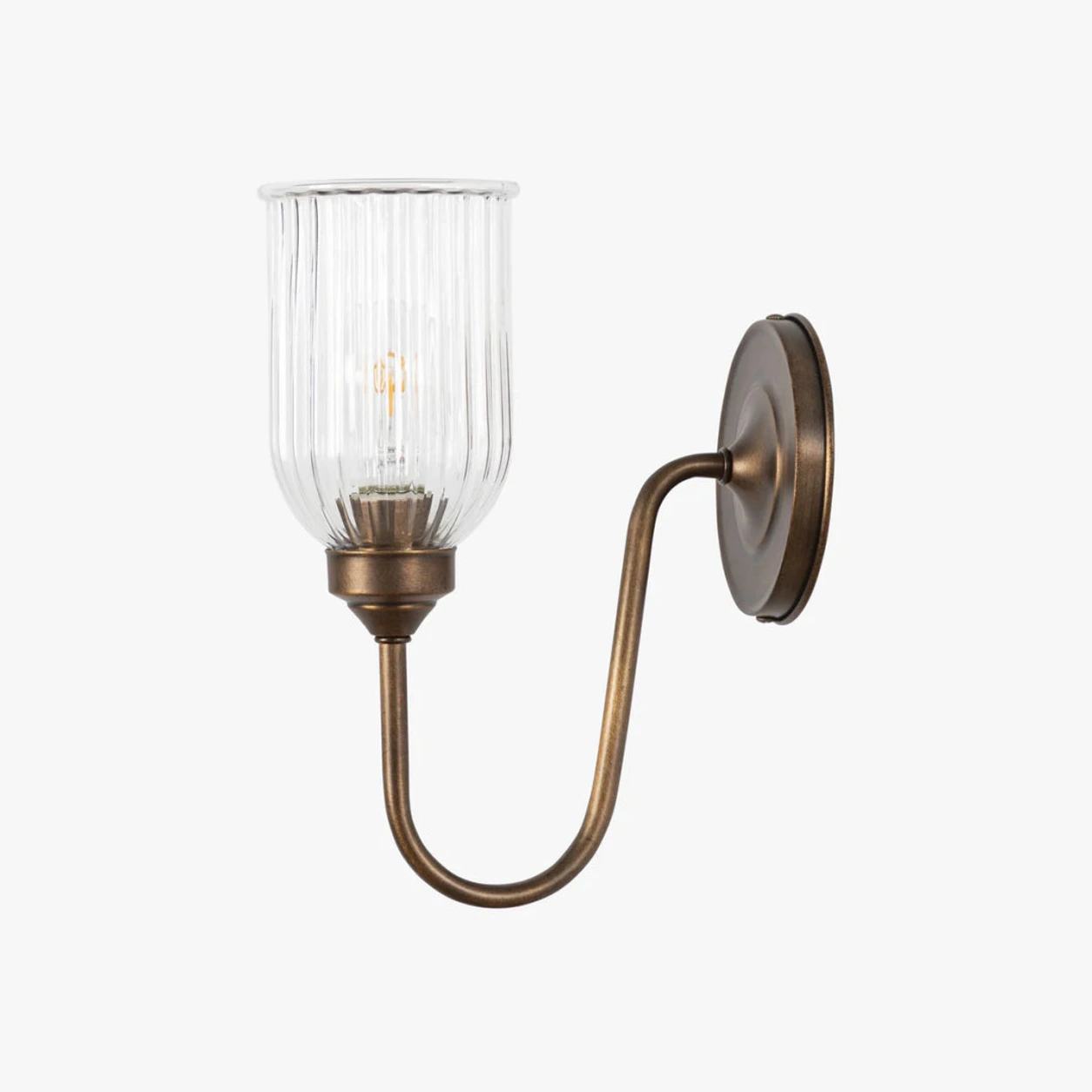 Menae Burnished Brass wall sconce on white