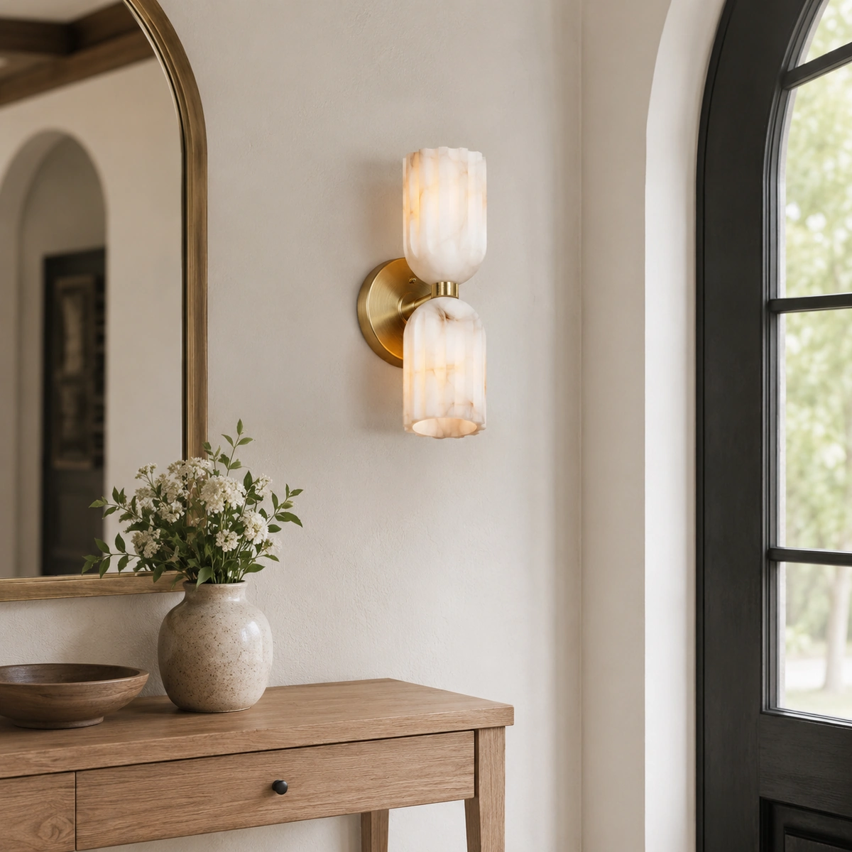 Antique Brass Lysander wall sconce in an entryway
