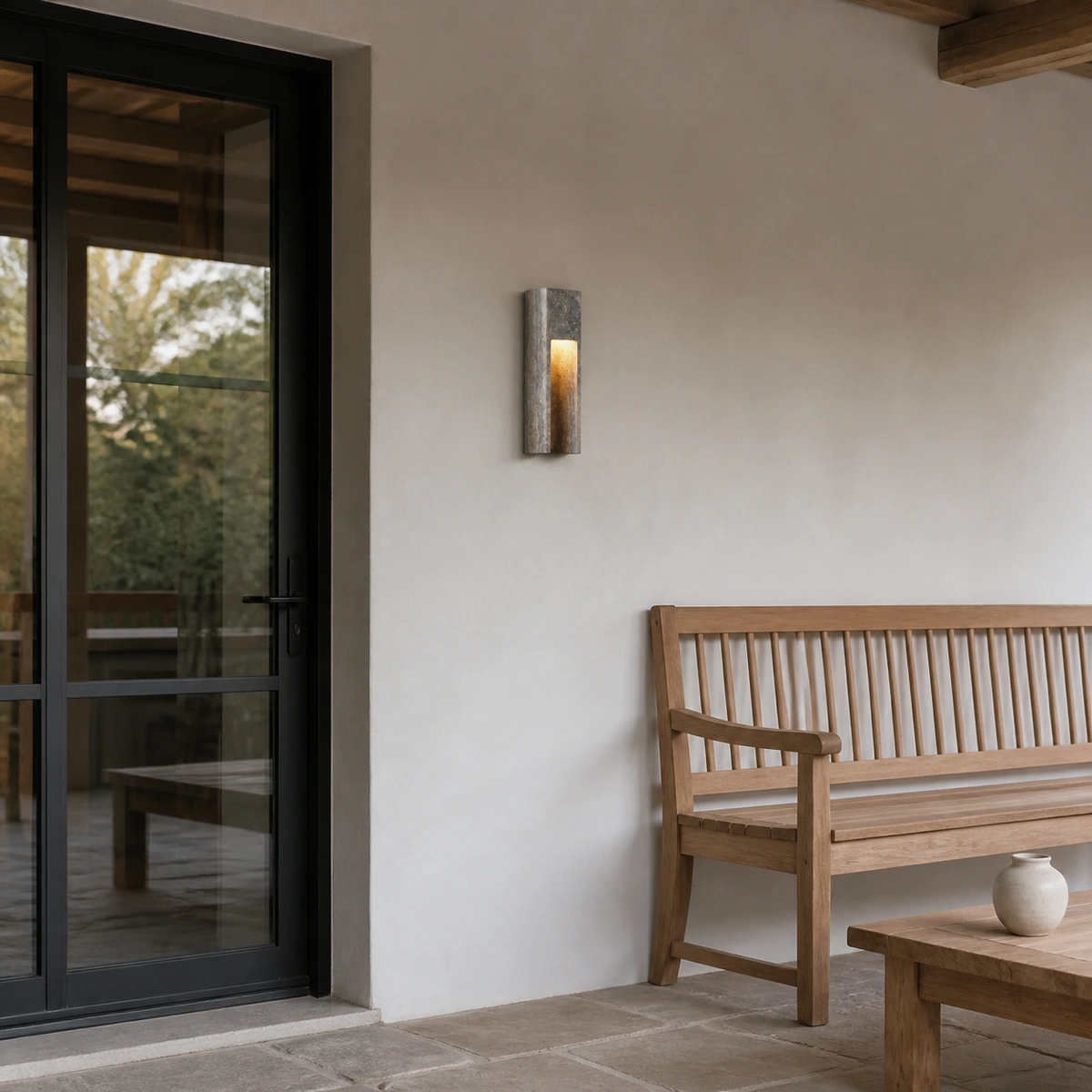 Zoey Minimalist Indoor-Outdoor Travertine Patio Wall Sconce in Covered patio - Dark Grey