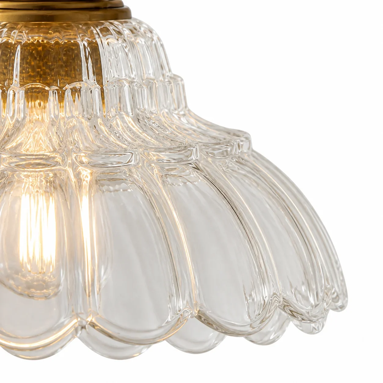 Close view of the Davit pendant light glass and antique-tone metal fitting
