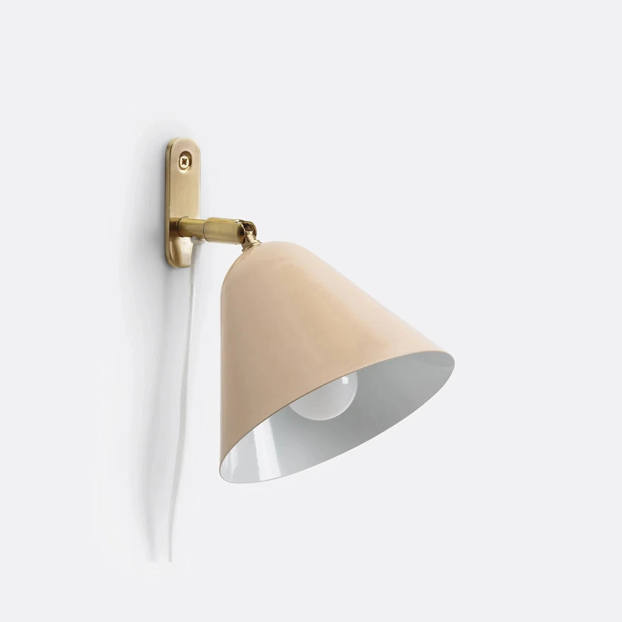 Blush Pink Phrike wall sconce on white