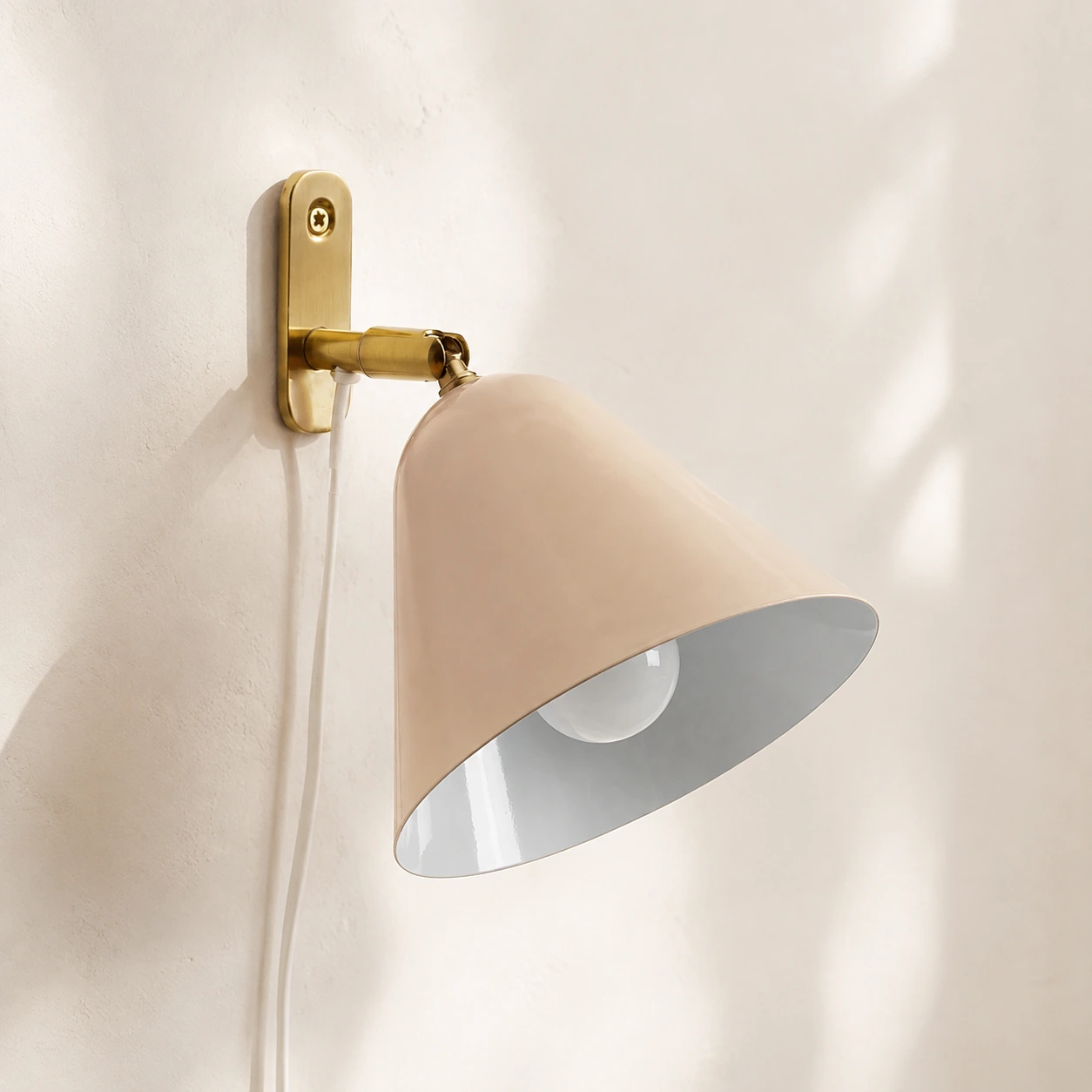 Phrike Vanilla wall sconce in natural daylight