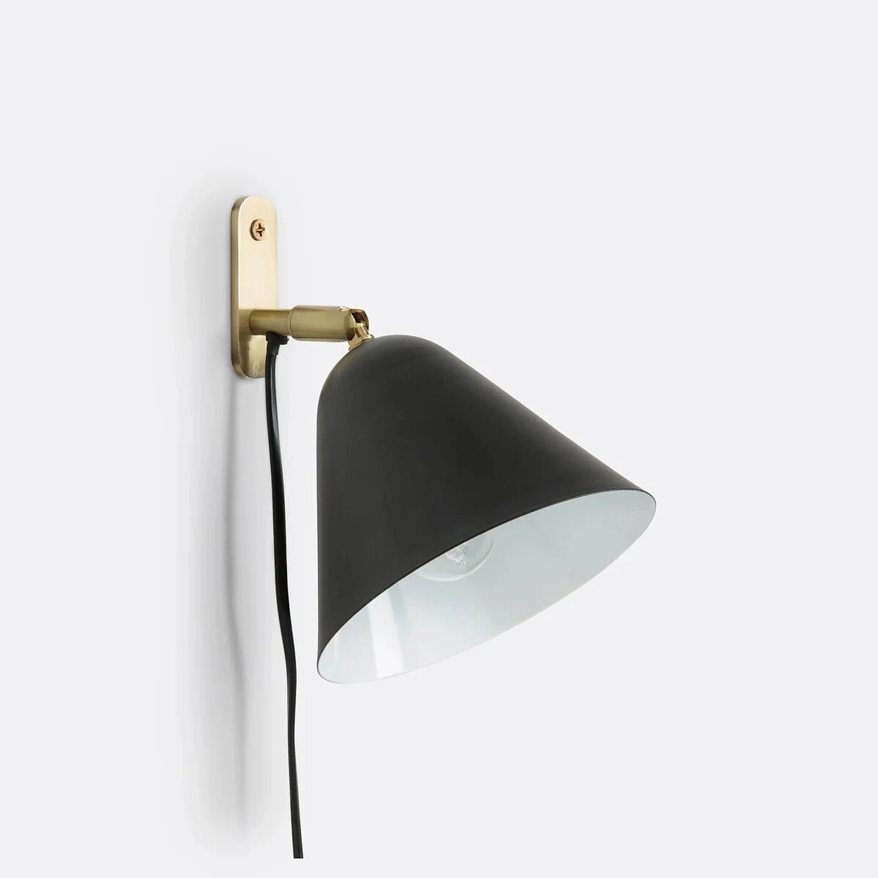 Matte Black Phrike wall sconce on white